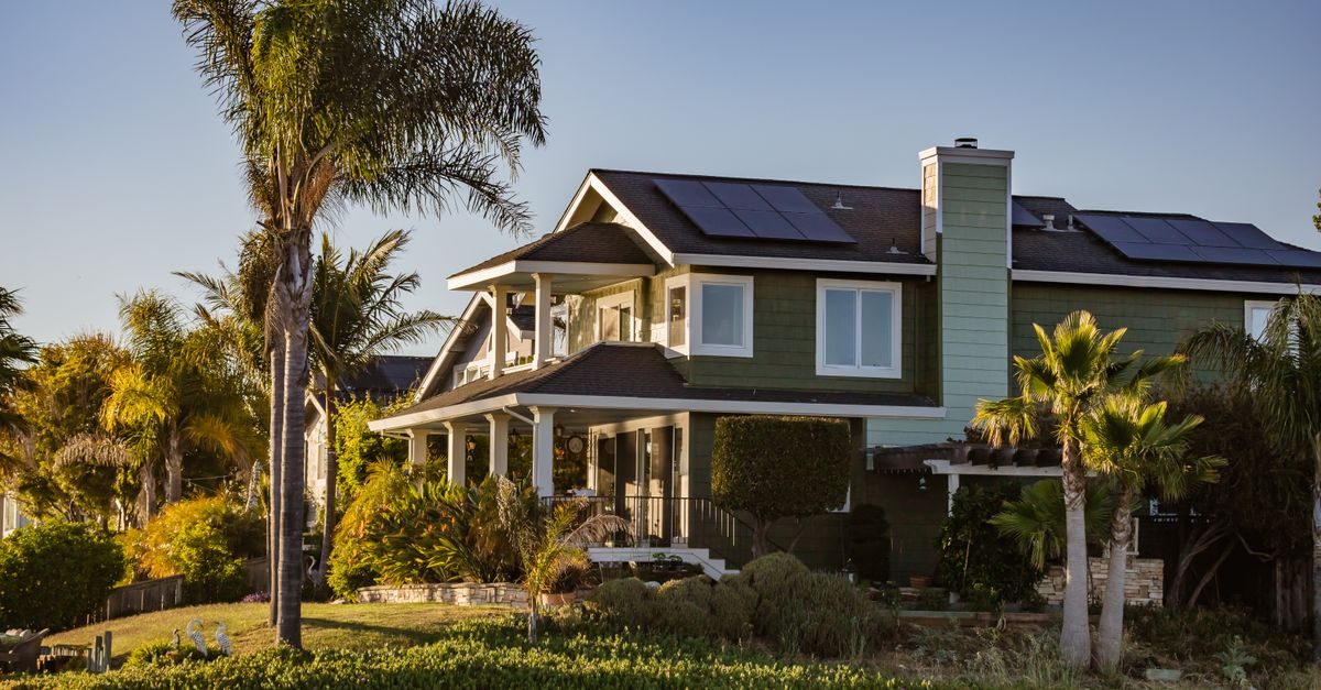 Modern home with rooftop solar panels