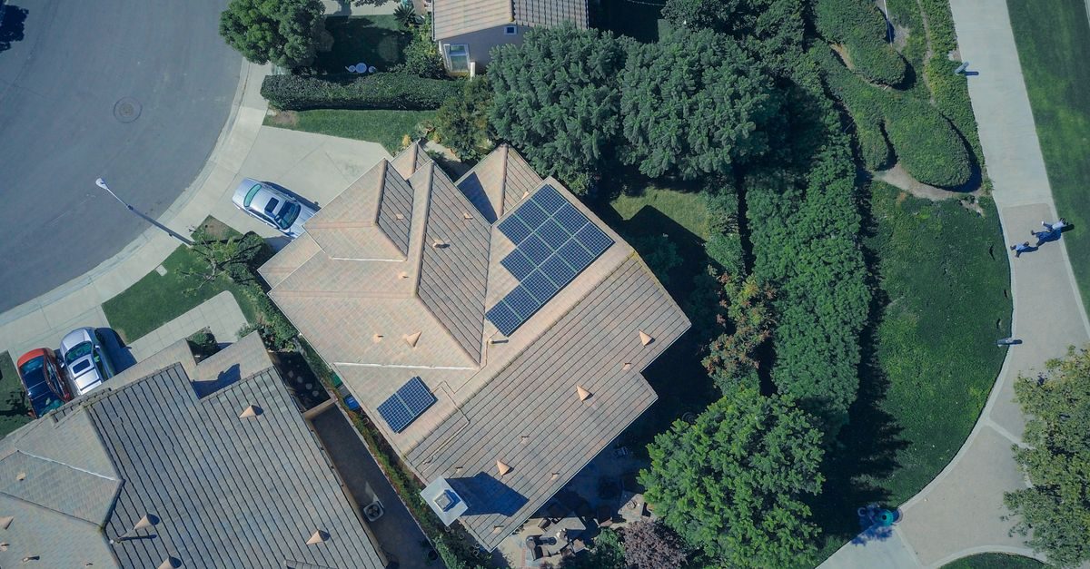 Suburban homes fitted with rooftop solar panels