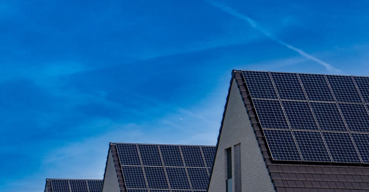 Solar panels on a rooftop against a blue sky